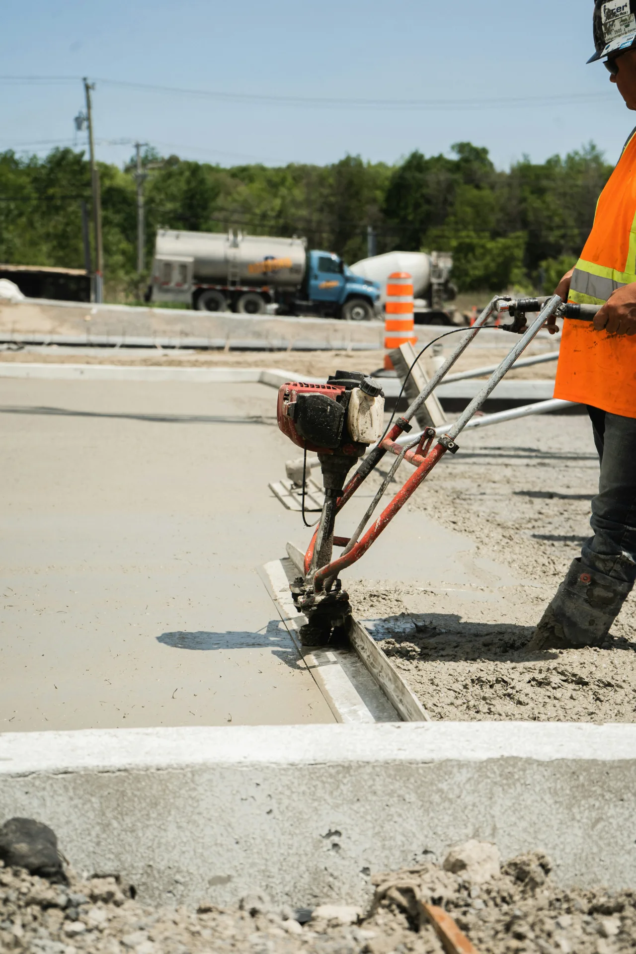 machine slipform curb and gutter being poured in Oshawa