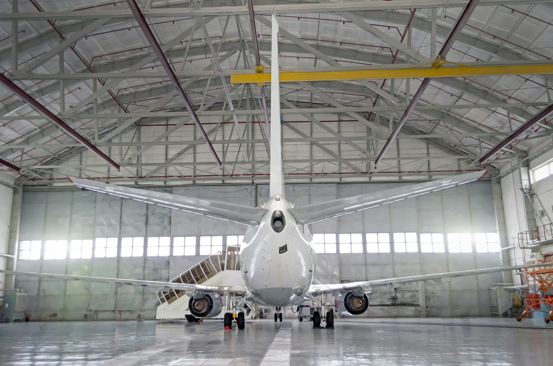 commercial jet on a finished concrete hangar floor in Oshawa