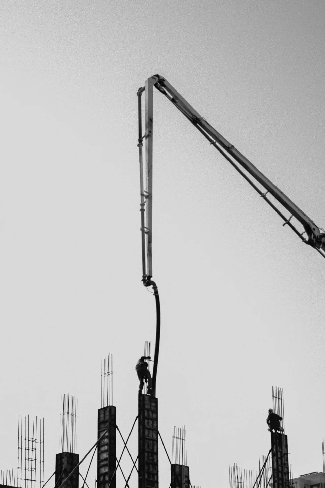 concrete pump and rebar on a tilt-up construction site in Oshawa