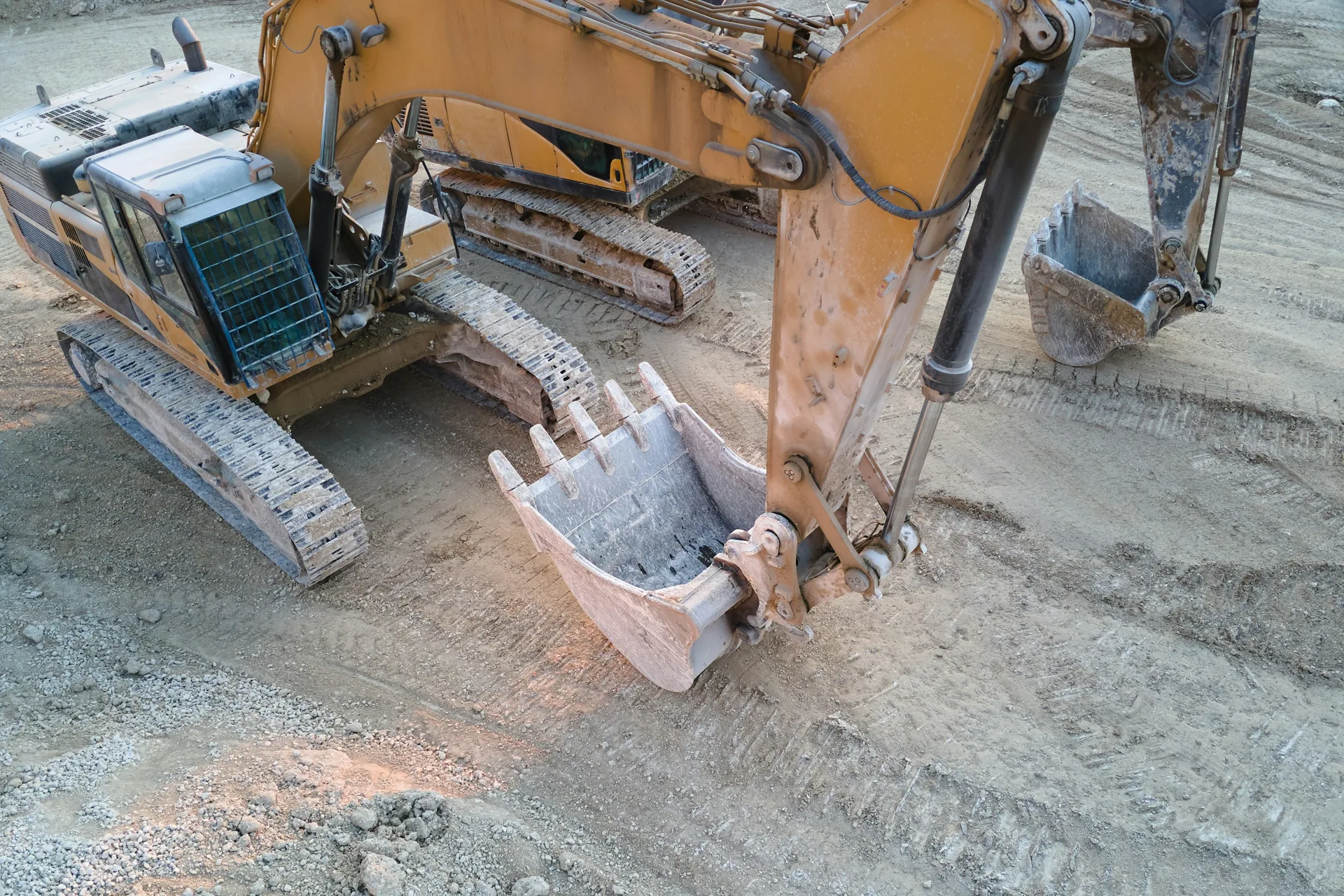 excavator working on a heavy-equipment concrete pad in Oshawa