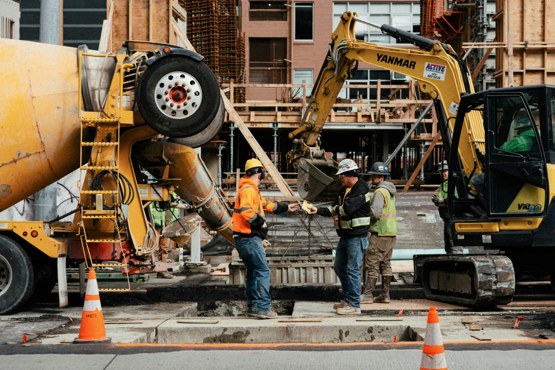 ready mix concrete pour on a Oshawa urban site with a mini excavator