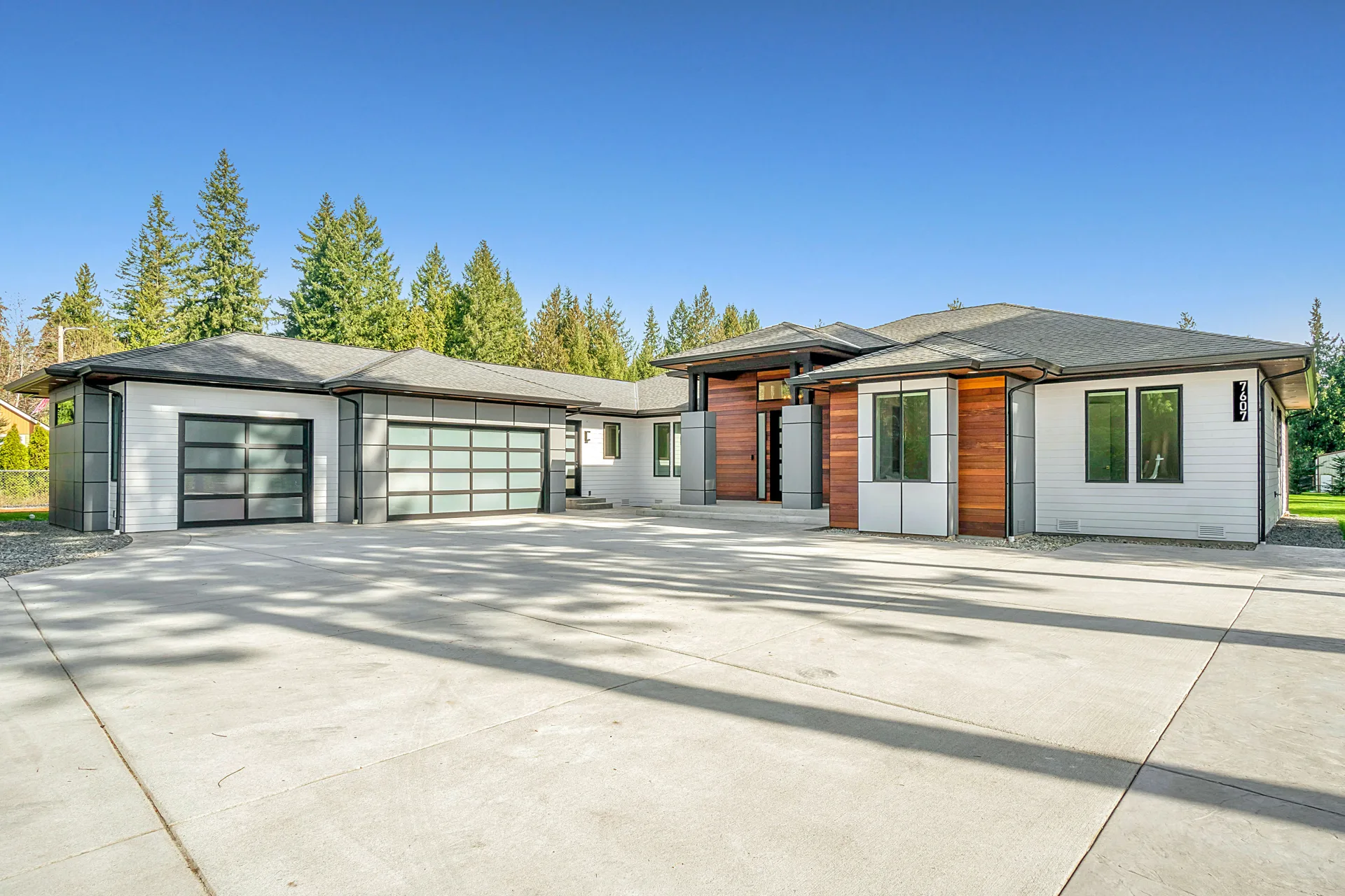 new concrete driveway at a modern three-car-garage Oshawa home