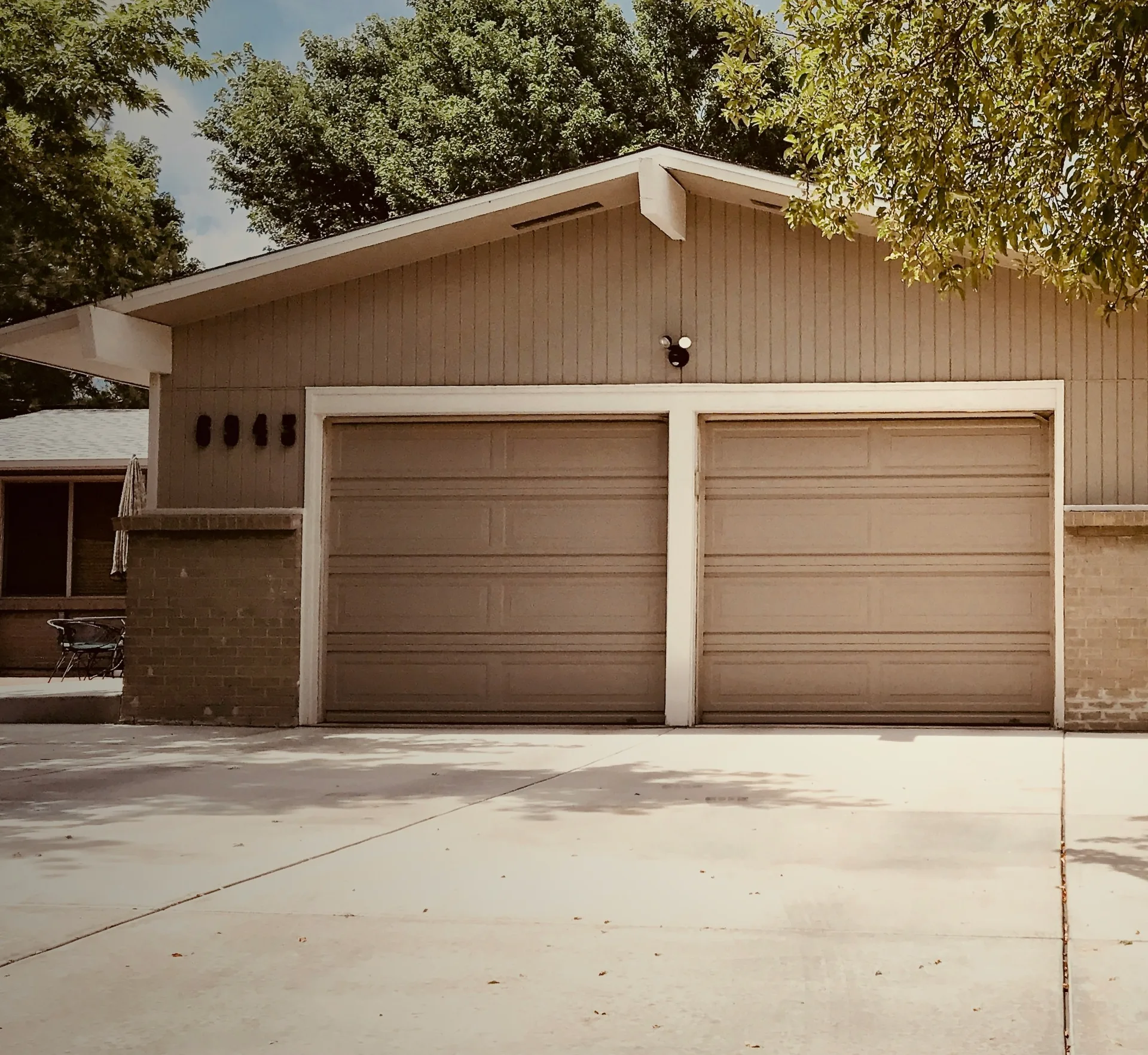 concrete driveway at a ranch home with a double garage in Oshawa