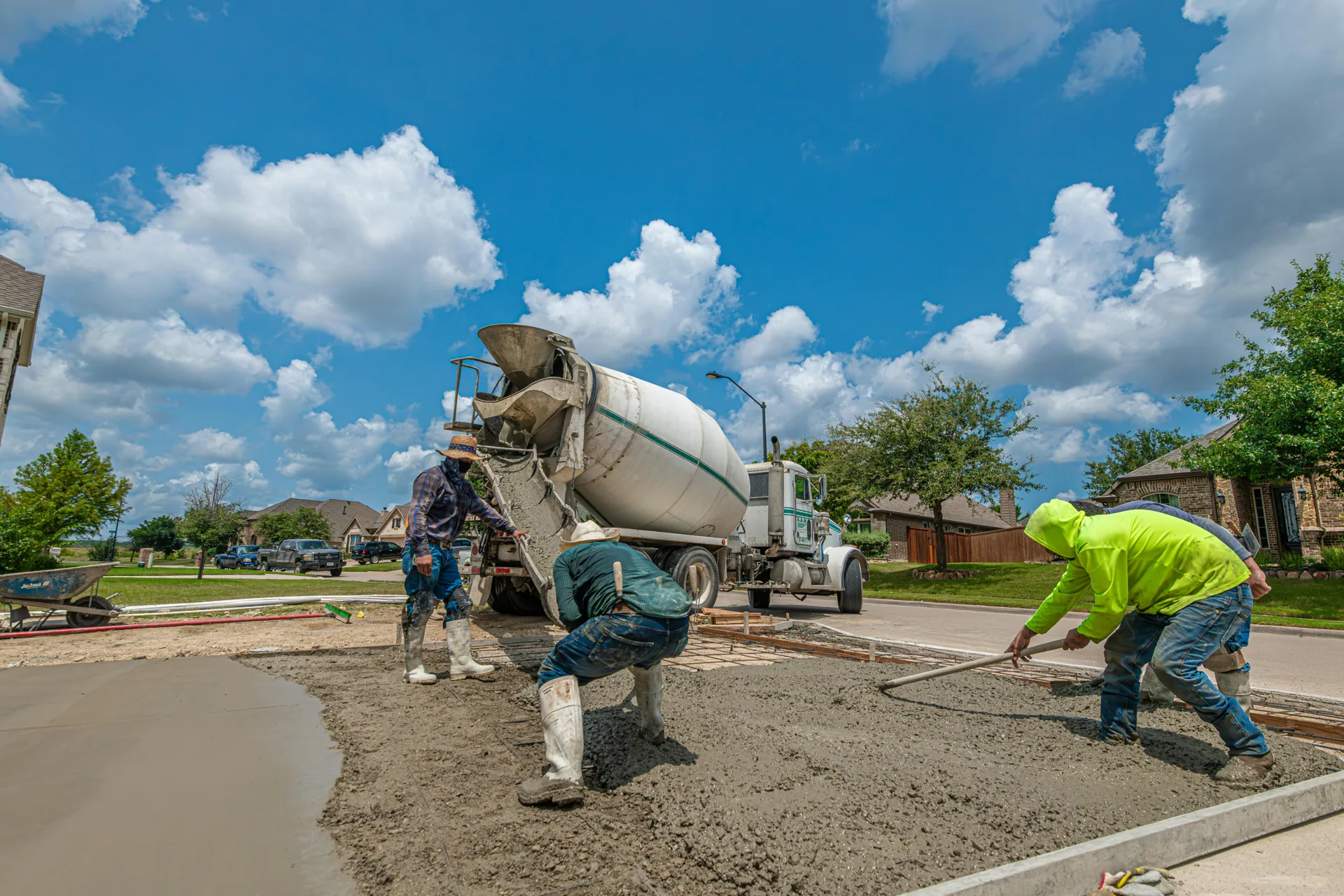 Oshawa concrete crew finishing a fresh driveway pour