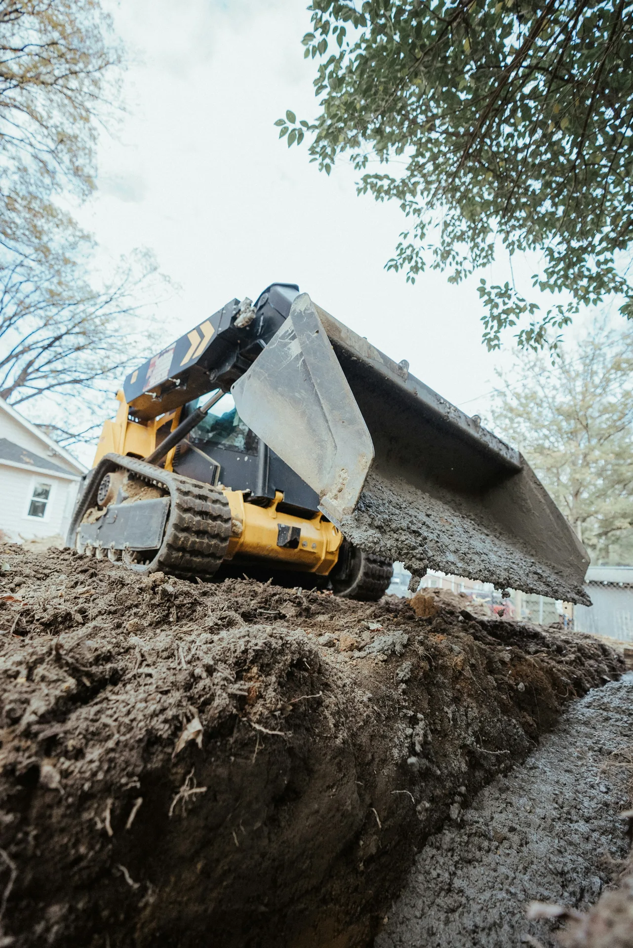 foundation repair pour with a track loader in Oshawa